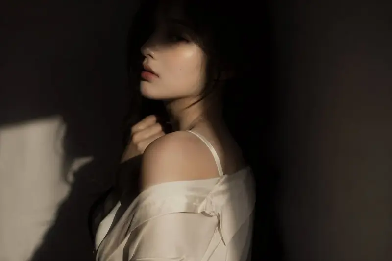editorial portrait, Korean female idol, subtly sensual  outfit: silk shirt or soft fabri